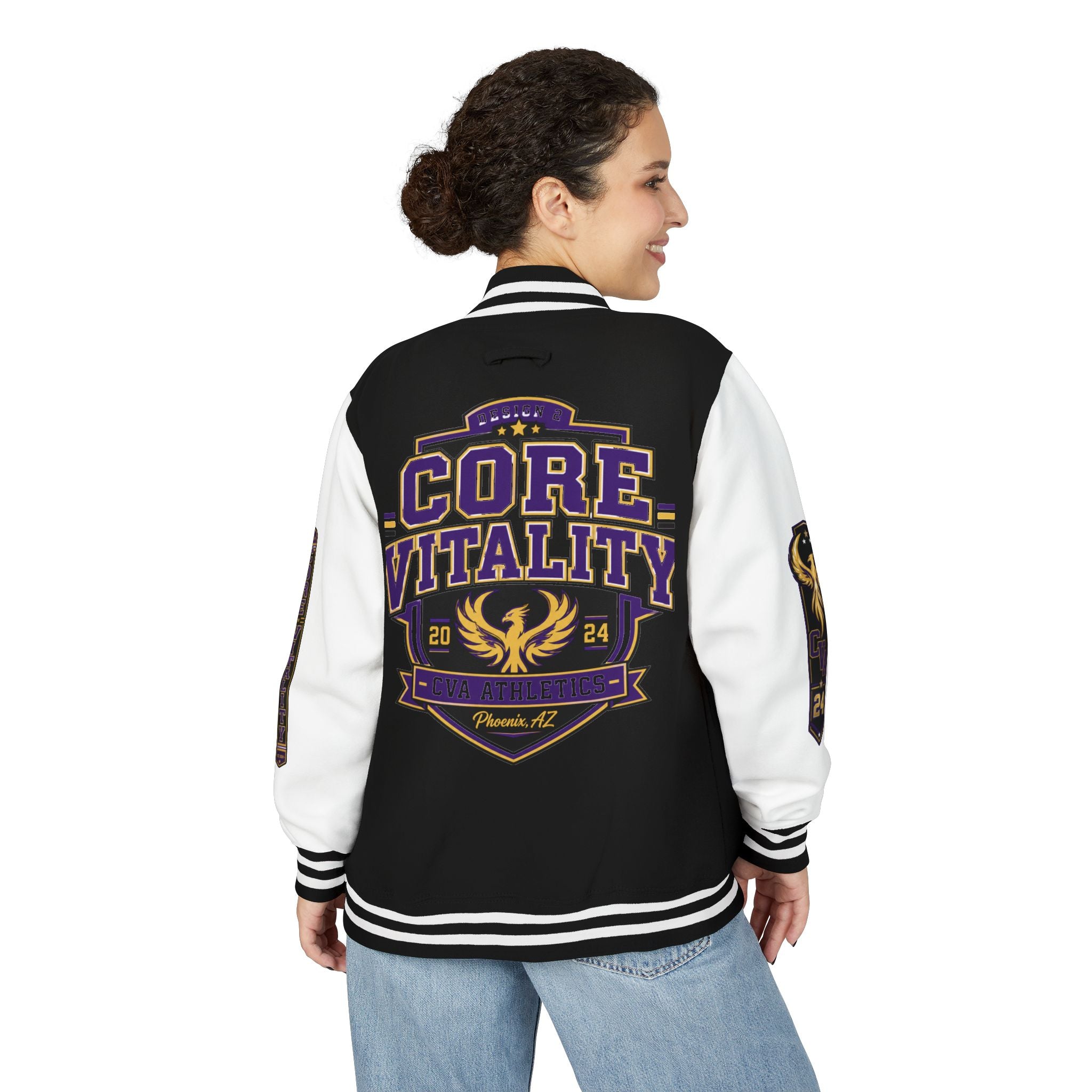 Person wearing a black and white varsity jacket with 'Core Vitality' design on a white background