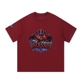 A maroon short-sleeve t-shirt with a detailed graphic on the chest featuring a crown, roses, and the text 'My Heart Bleeds For You' in stylized lettering, shown against a plain white background.