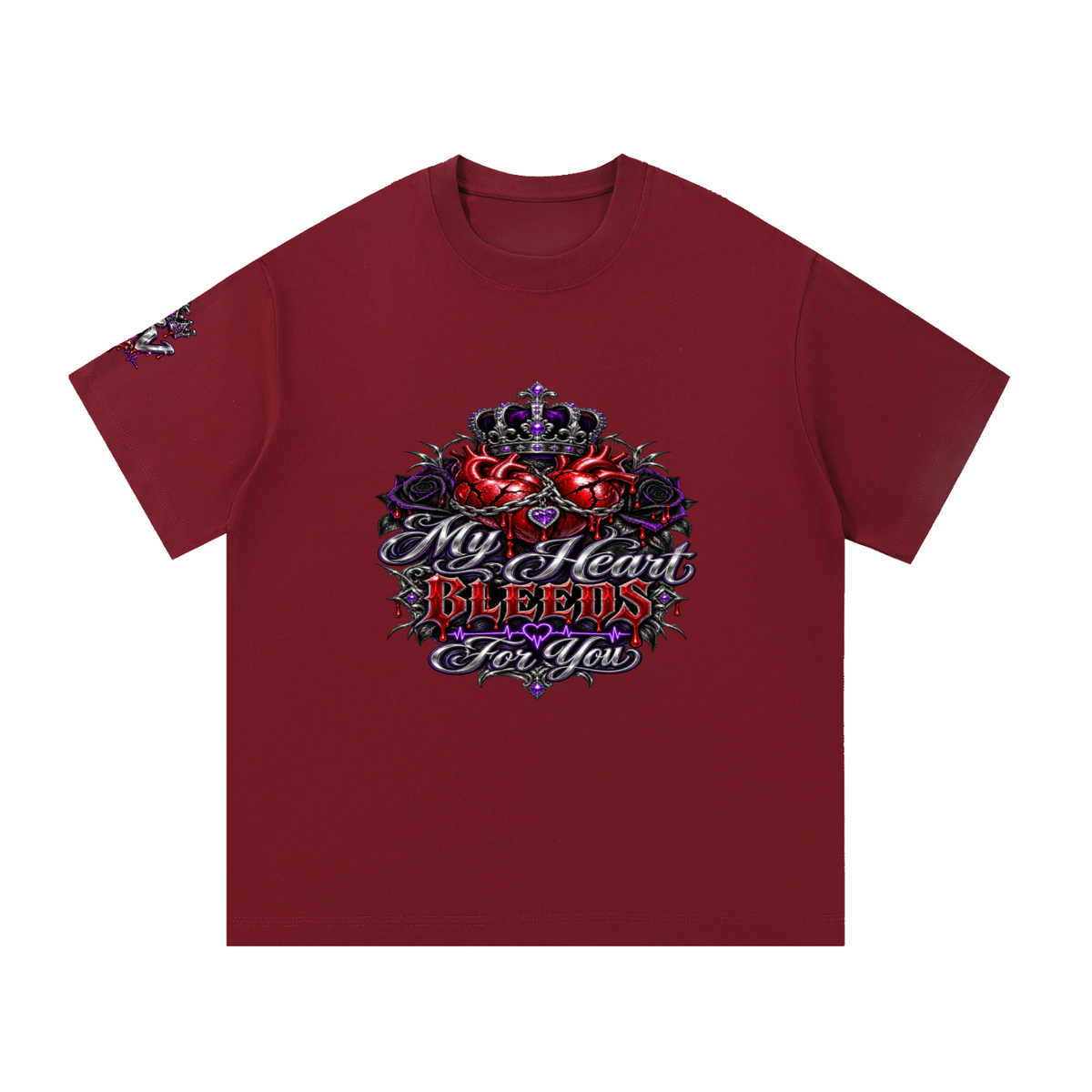A maroon short-sleeve t-shirt with a detailed graphic on the chest featuring a crown, roses, and the text 'My Heart Bleeds For You' in stylized lettering, shown against a plain white background.